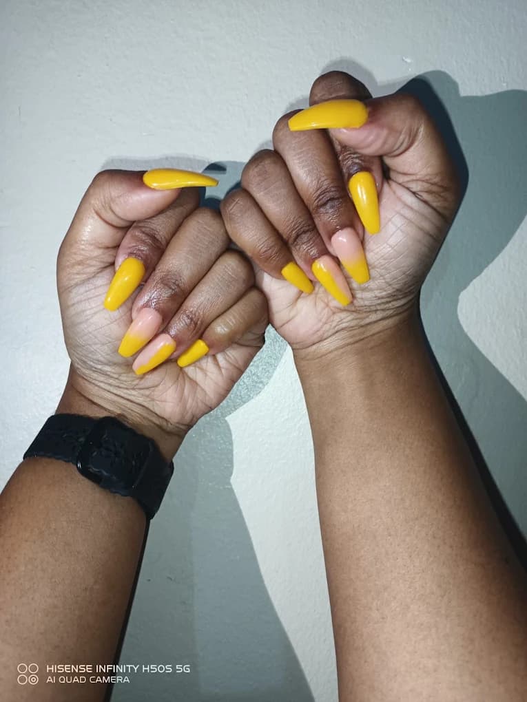 Coffin nails in a soft buttery yellow.