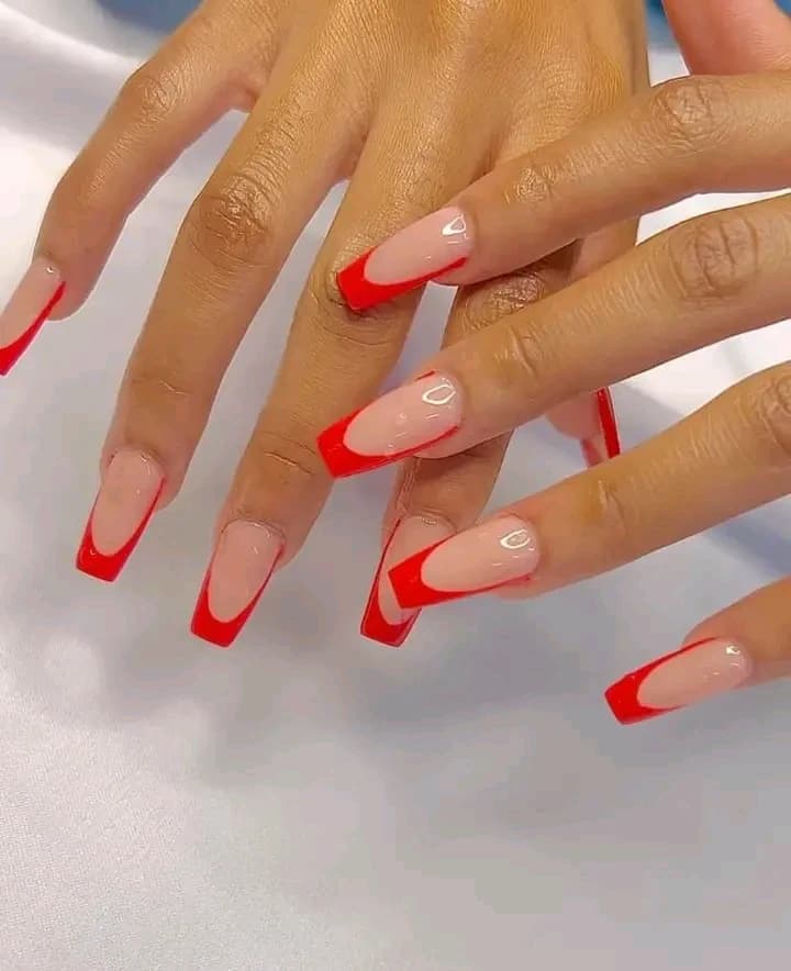 Long coffin nails with bright red french tips.